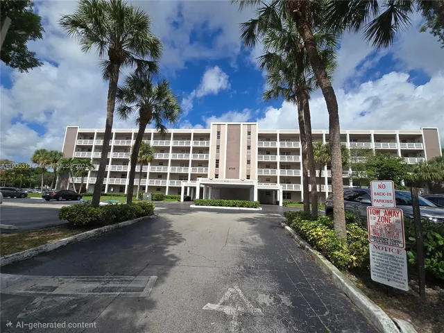 a view of a blue house with a yard and large trees