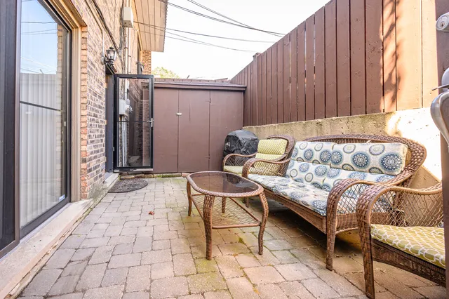 a outdoor space with a couch and a window