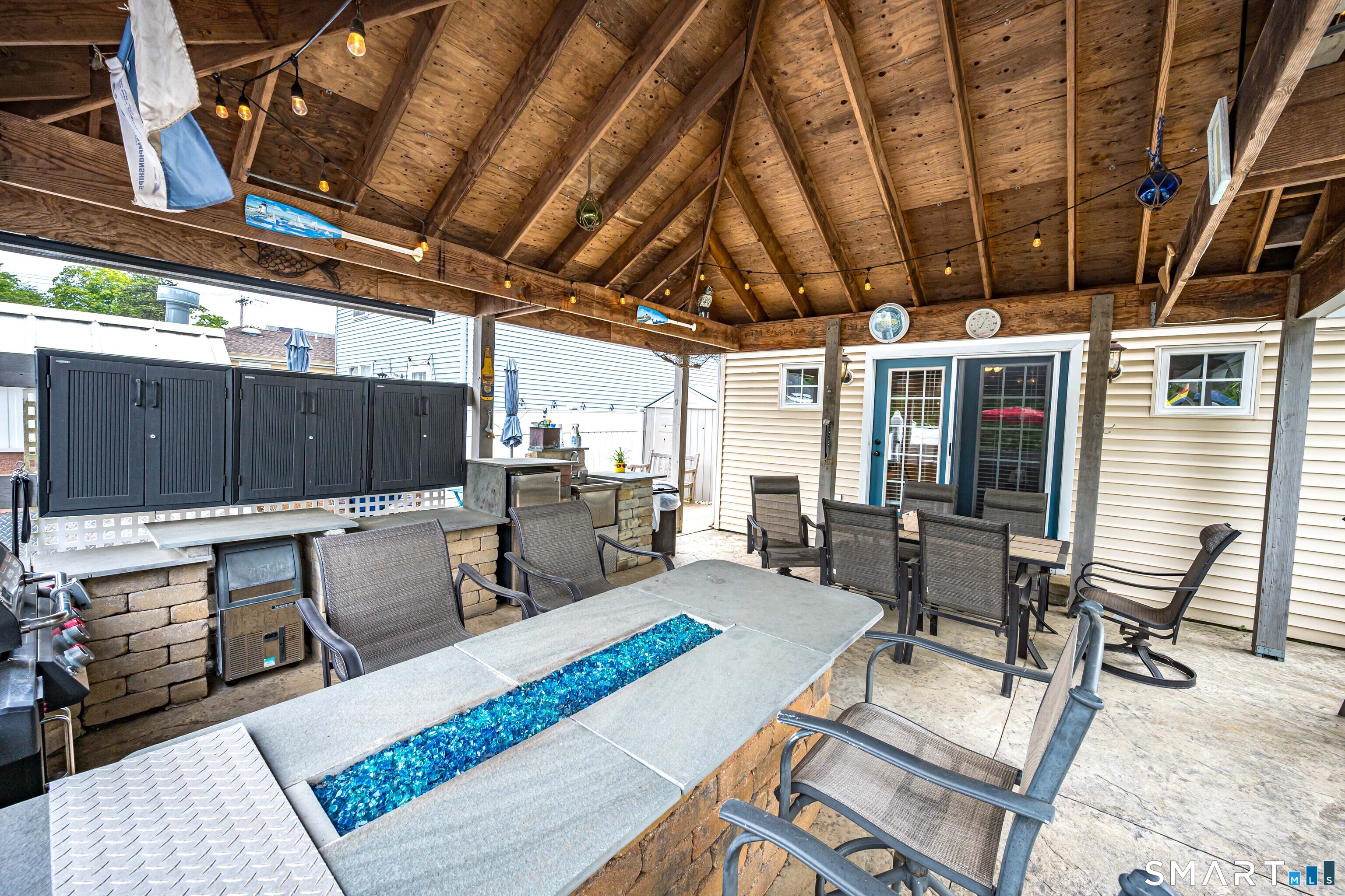 58 Minor Road East Haven, CT 06512 - Photo 29 of 40 There is a flat screen TV with cable hookup under the canopy that will convey! Watch the games outside while grilling!