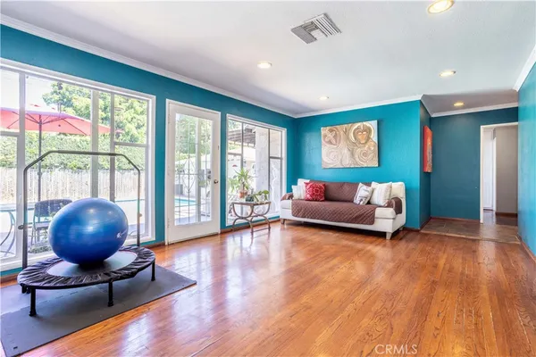 a spacious bathroom with a double vanity sink a mirror and a shower