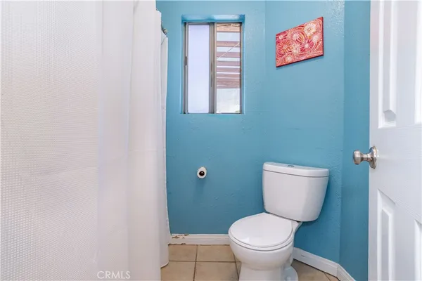 a patio with glass windows and yard