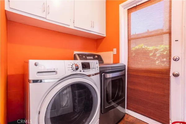 a living room with lots of furniture and a flat screen tv