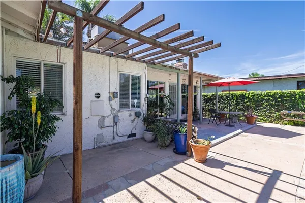 a view of a backyard with wooden fence