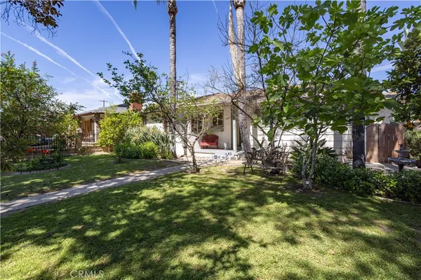 a kitchen with a stove top oven sink and refrigerator