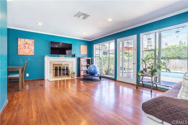 a view of a livingroom with furniture and wooden floor
