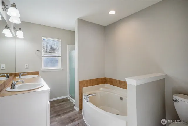 a bathroom with a bathtub sink and toilet