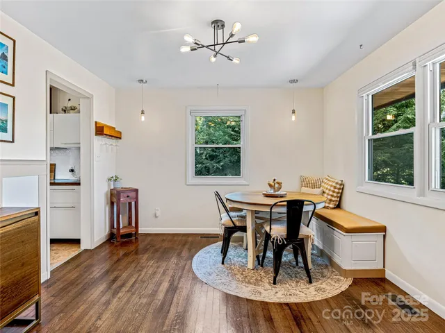 a view of a dining room with furniture window and outside view
