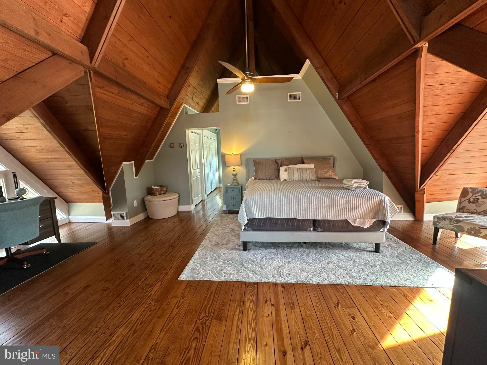 3351 Carroll Road Huntingtown, MD 20639 - Photo 16 of 20 Spacious loft bedroom with rustic charm.