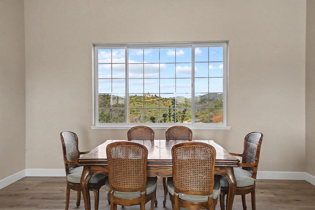 9515 Ham Luddy Road Mountain Ranch, CA 95246 - Photo 12 of 92 a view of a dining room with furniture window and wooden floor