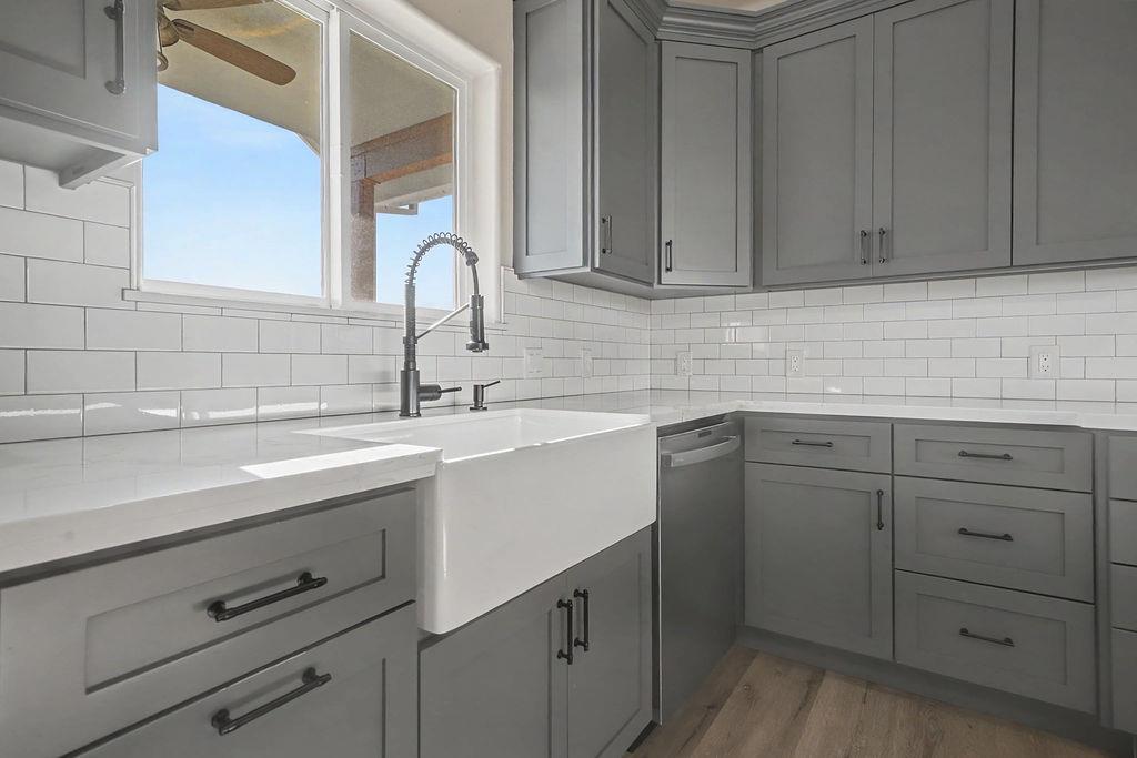 9515 Ham Luddy Road Mountain Ranch, CA 95246 - Photo 14 of 92 a view with cabinets a sink and dishwasher in a kitchen