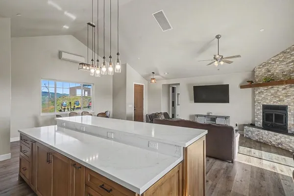 a kitchen with a sink stove and microwave