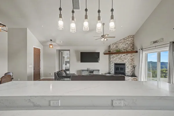 a kitchen with a stove a sink and a microwave