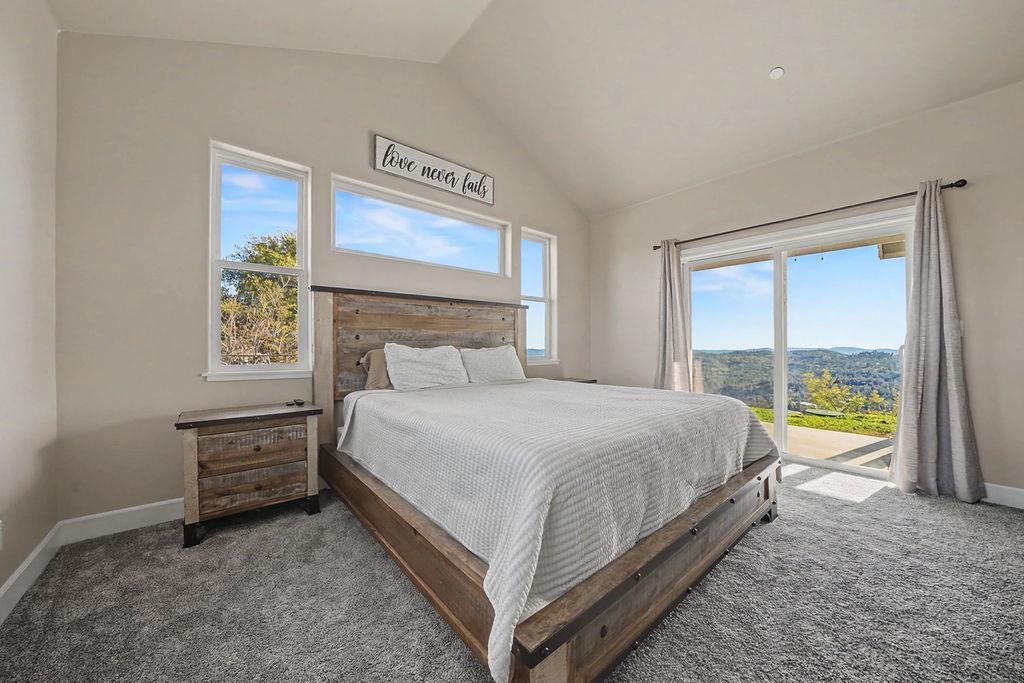 9515 Ham Luddy Road Mountain Ranch, CA 95246 - Photo 29 of 92 a bedroom with a bed and a window