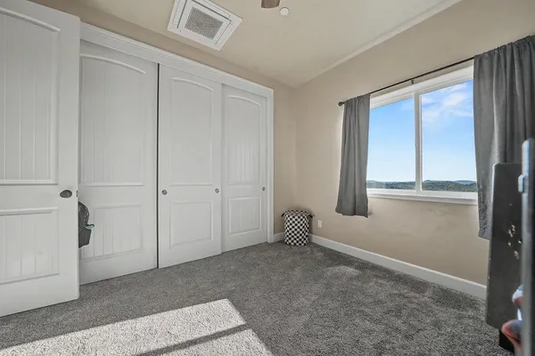 a view of a backyard of the house