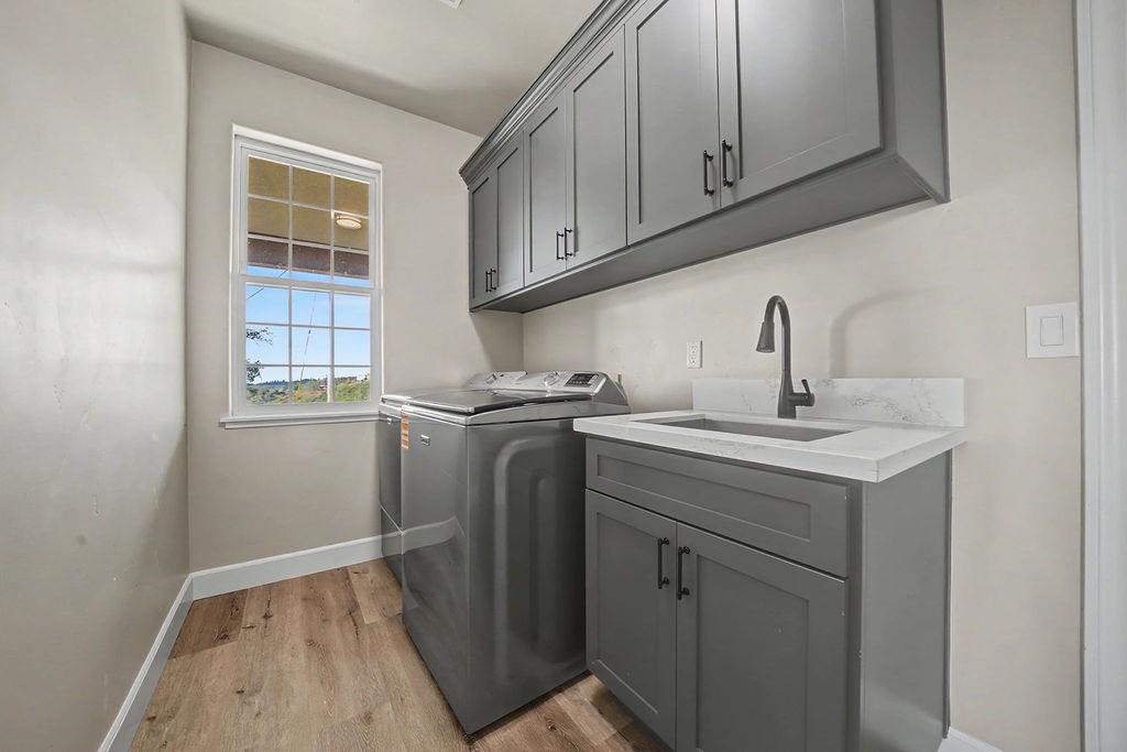 9515 Ham Luddy Road Mountain Ranch, CA 95246 - Photo 39 of 92 a kitchen with a sink cabinets and a window