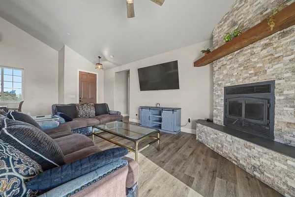 a living room with furniture and a fireplace