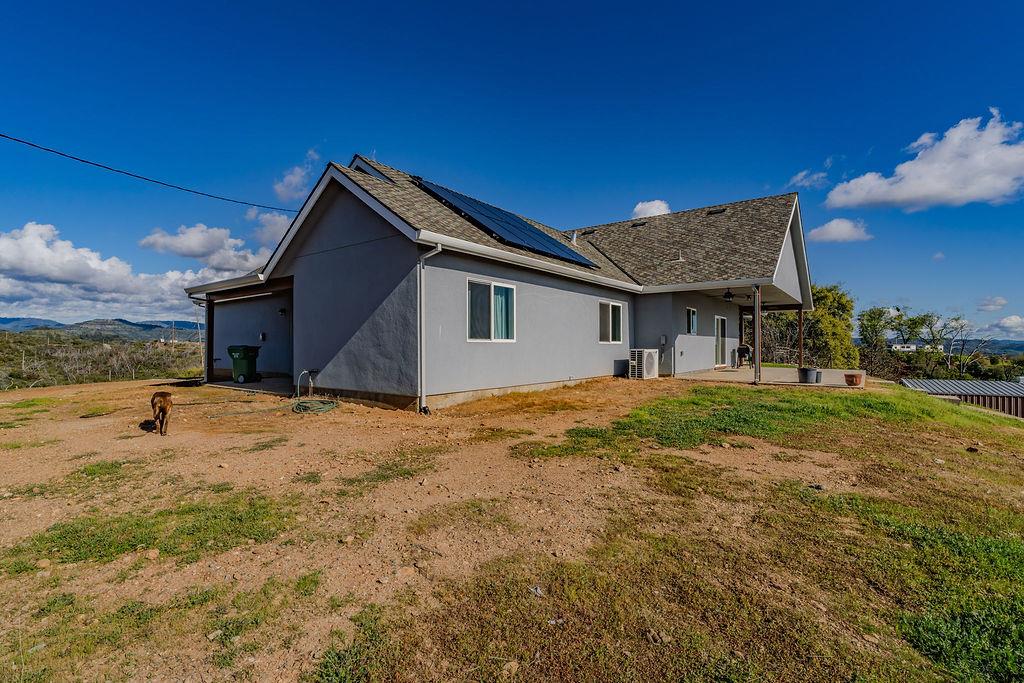9515 Ham Luddy Road Mountain Ranch, CA 95246 - Photo 48 of 92 a view of a house with backyard and a tree