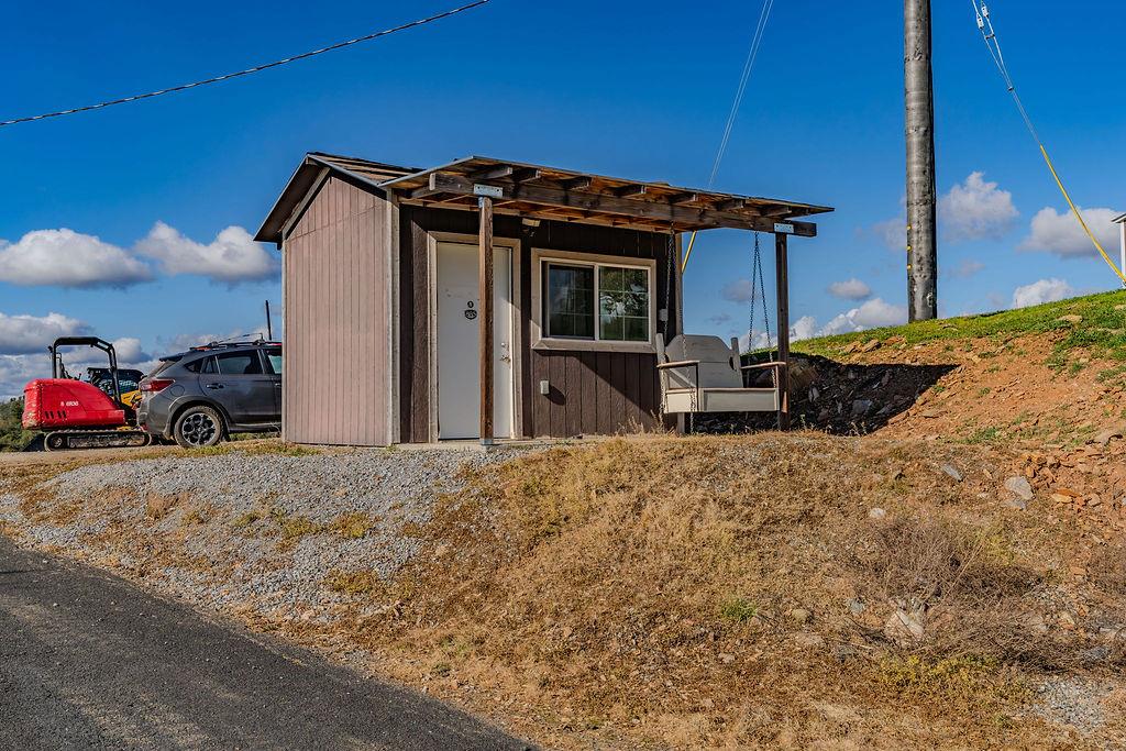 9515 Ham Luddy Road Mountain Ranch, CA 95246 - Photo 65 of 92 a front view of a house with parking space