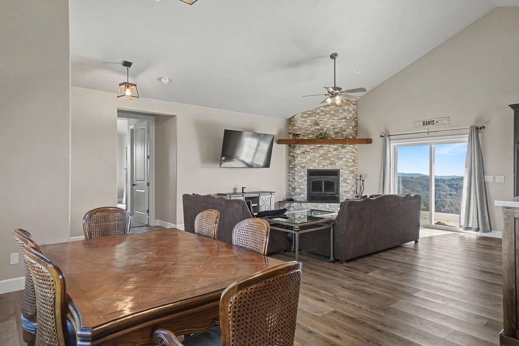 9515 Ham Luddy Road Mountain Ranch, CA 95246 - Photo 10 of 92 a living room with furniture a fireplace and a chandelier