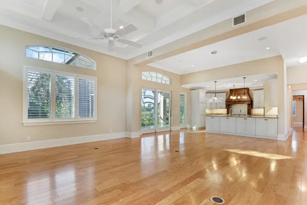 a kitchen with kitchen island a sink appliances and cabinets