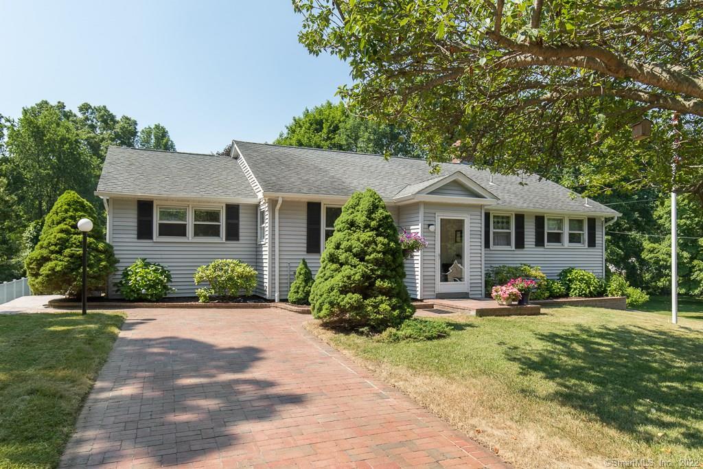 8 Fairview Road Woodbridge, CT 06525 - Photo 1 of 1 a front view of a house with garden and porch