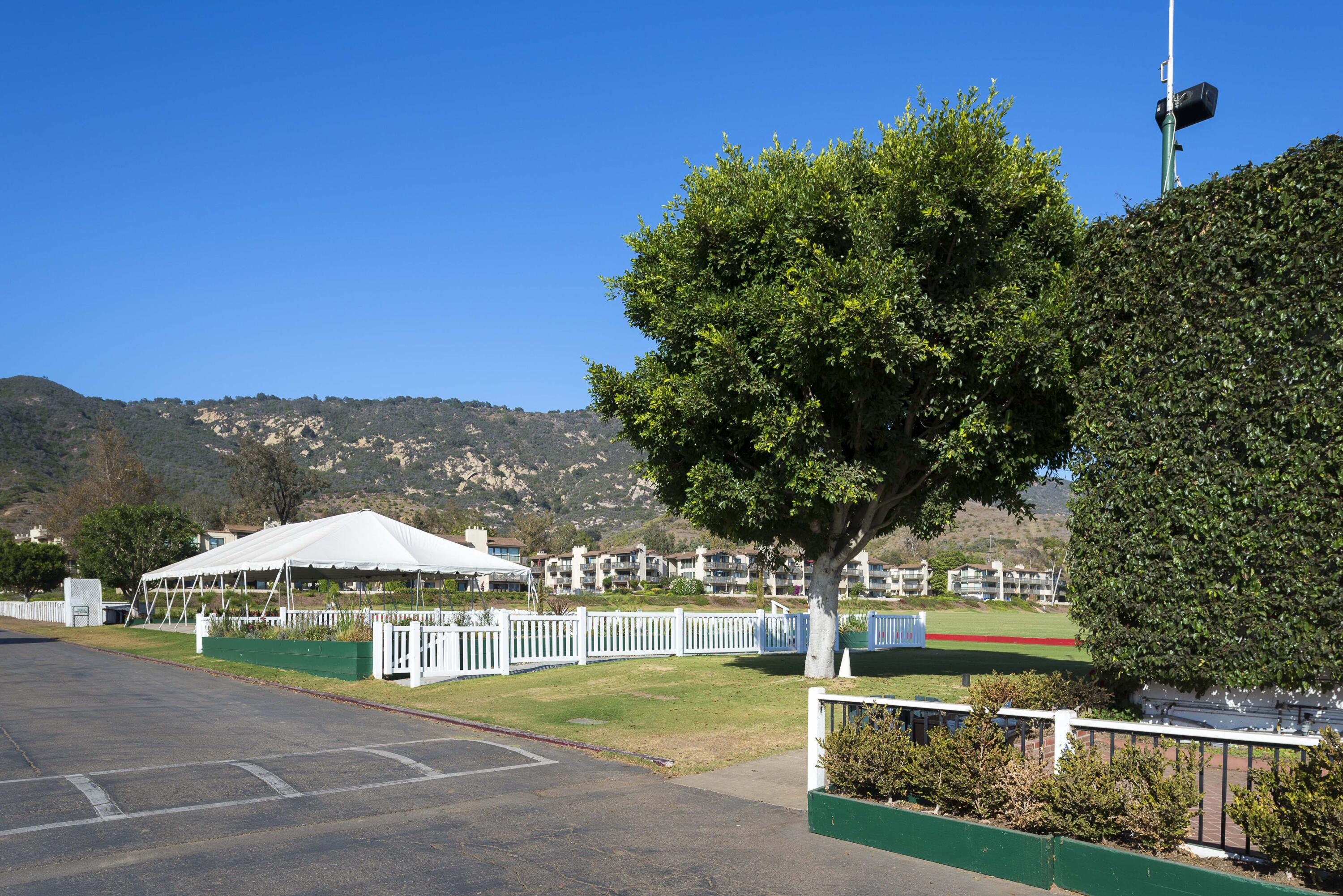 3375 Foothill Road, Unit 1121 Carpinteria, CA 93013 - Photo 19 of 24 a sign board with yard in the back