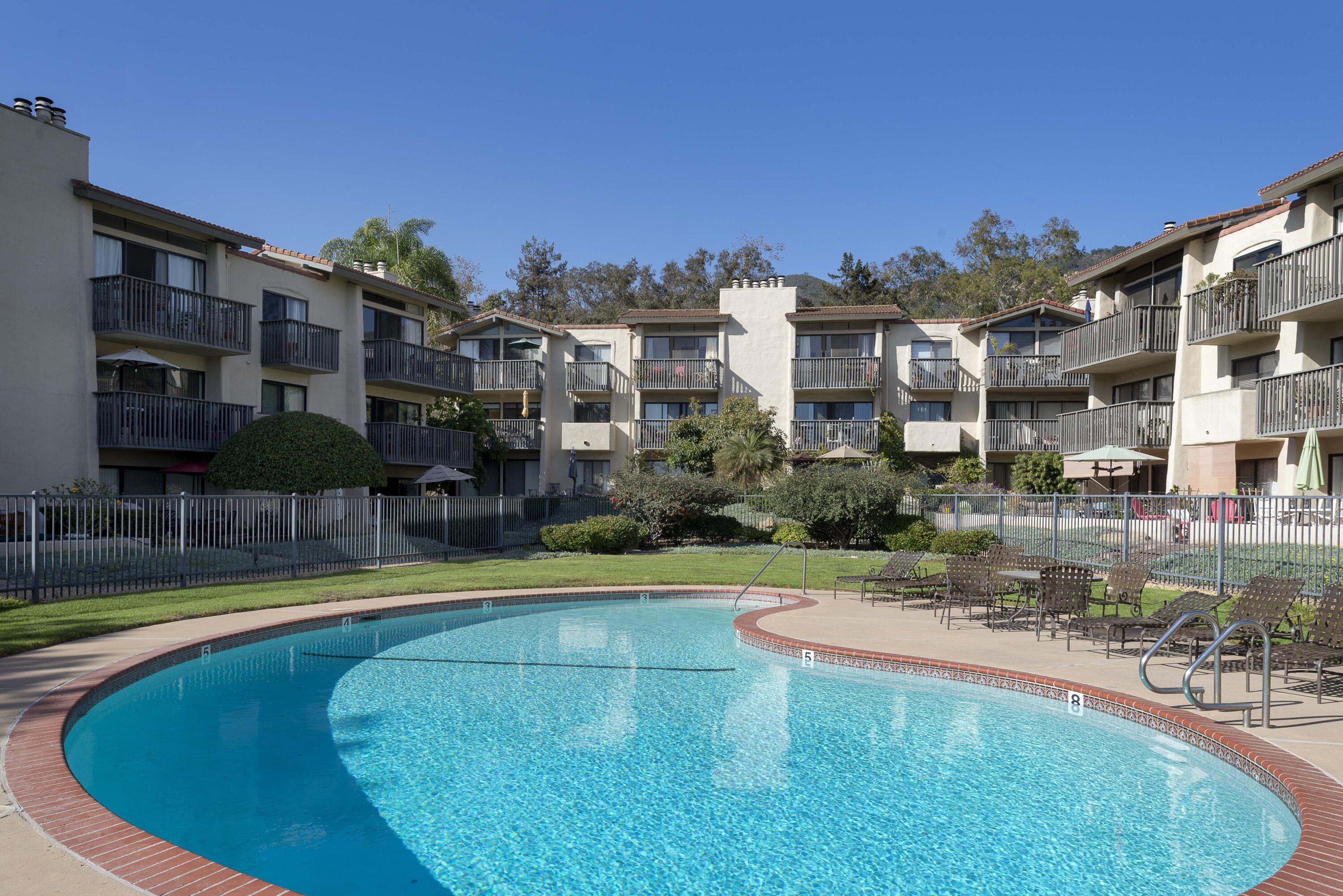 3375 Foothill Road, Unit 1121 Carpinteria, CA 93013 - Photo 24 of 24 a swimming pool with outdoor seating and yard