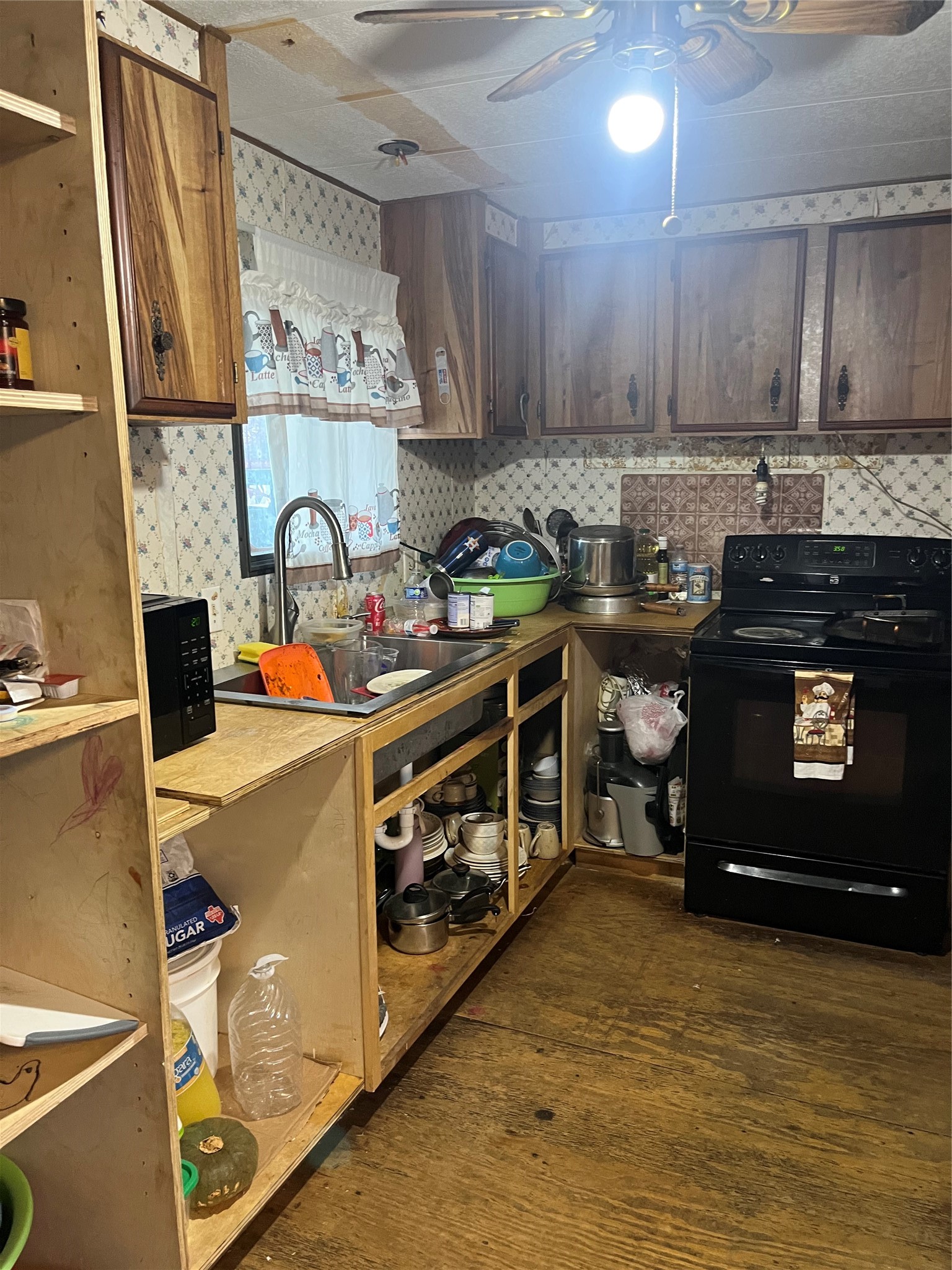 7967 Addison Belle Drive Conroe, TX 77306 - Photo 7 of 10 a kitchen with a stove and a refrigerator