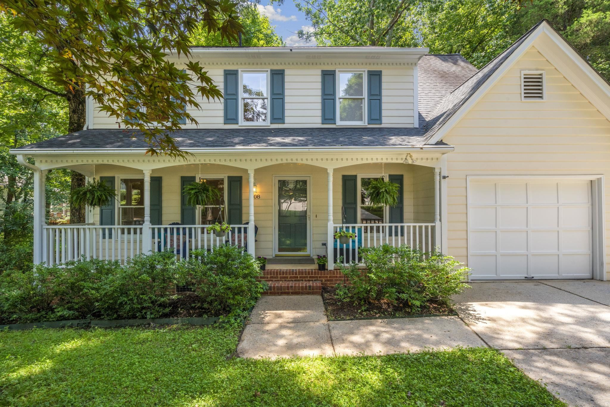 108 Rushingwater Drive Cary, NC 27513 - Photo 1 of 37 a view of a brick house with a yard plants and large tree