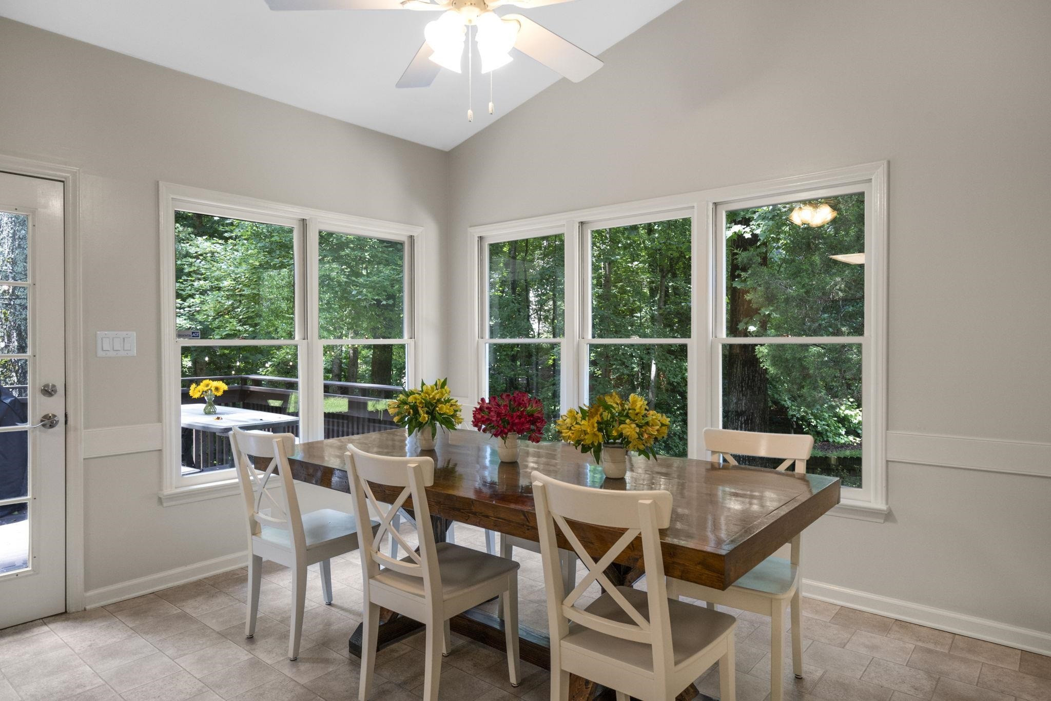 108 Rushingwater Drive Cary, NC 27513 - Photo 12 of 37 a view of a dining room with furniture large windows and garden view