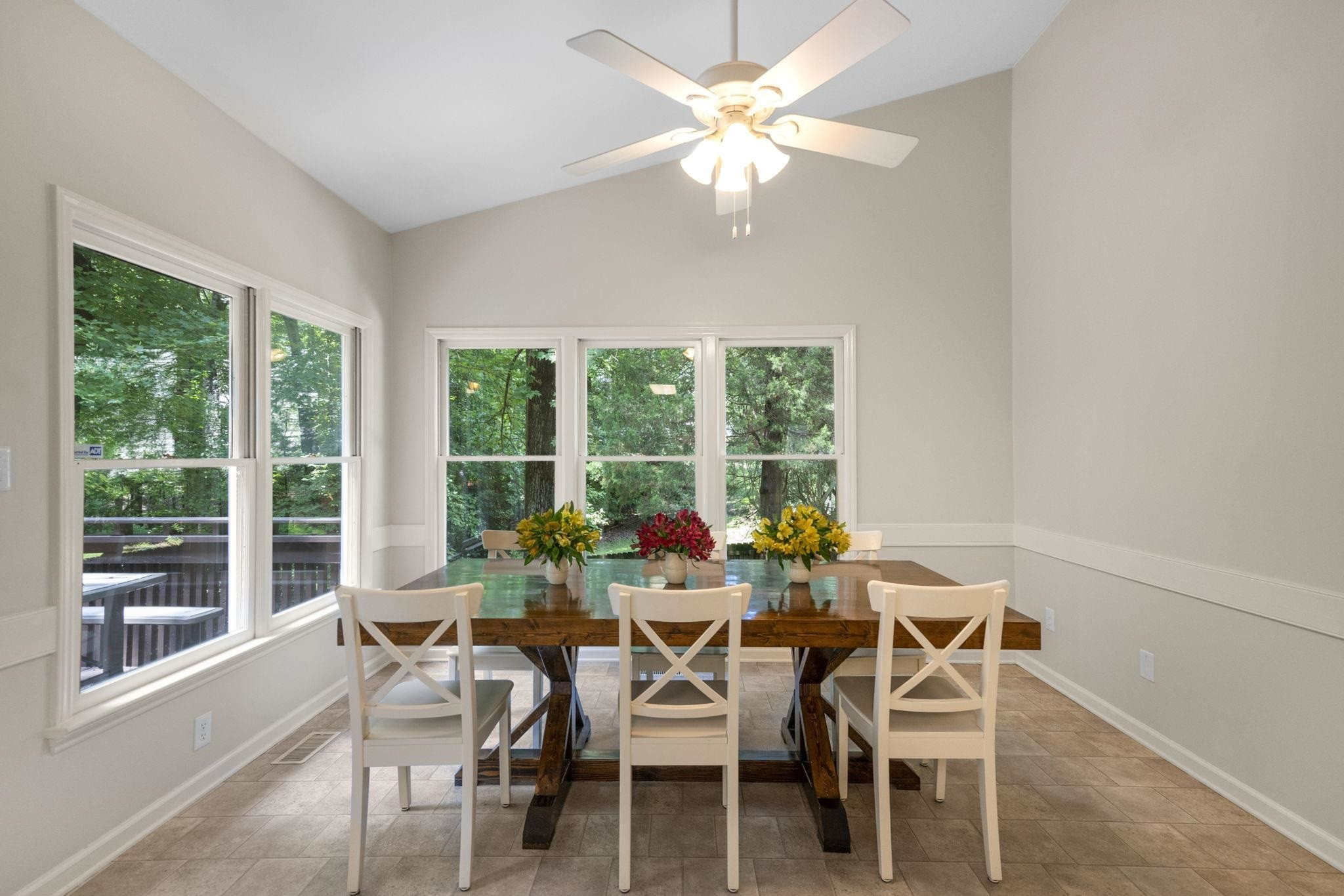 108 Rushingwater Drive Cary, NC 27513 - Photo 13 of 37 a dining room with furniture a chandelier and a large window