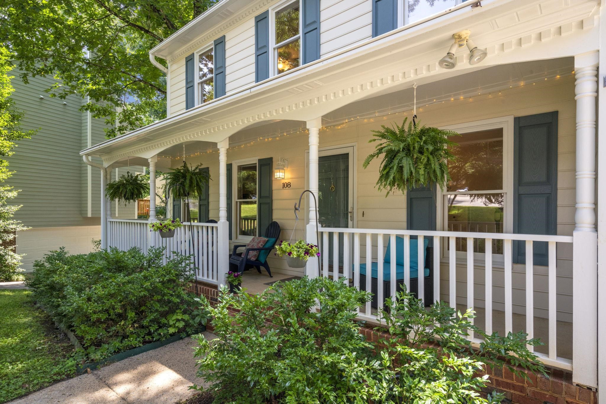 108 Rushingwater Drive Cary, NC 27513 - Photo 2 of 37 a view of a house with potted plants and a table and chair