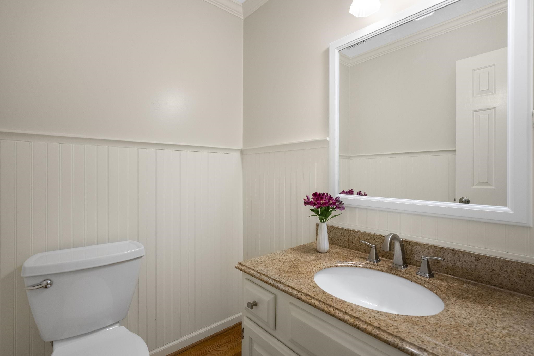 108 Rushingwater Drive Cary, NC 27513 - Photo 24 of 37 a bathroom with a granite countertop sink and a mirror