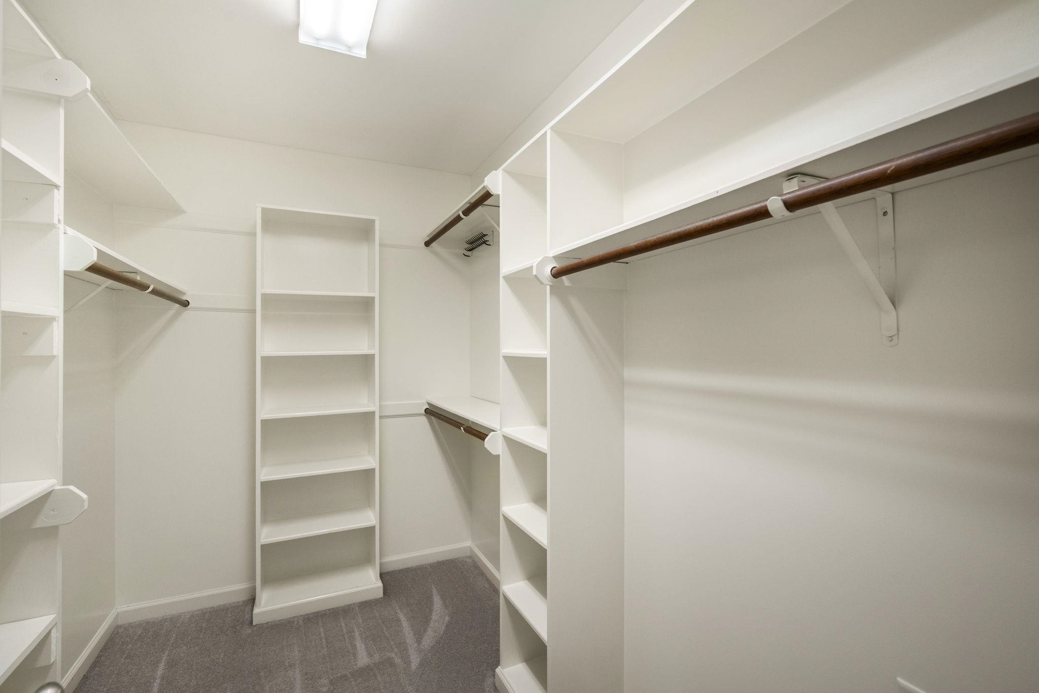 108 Rushingwater Drive Cary, NC 27513 - Photo 28 of 37 a view of walk in closet with empty racks