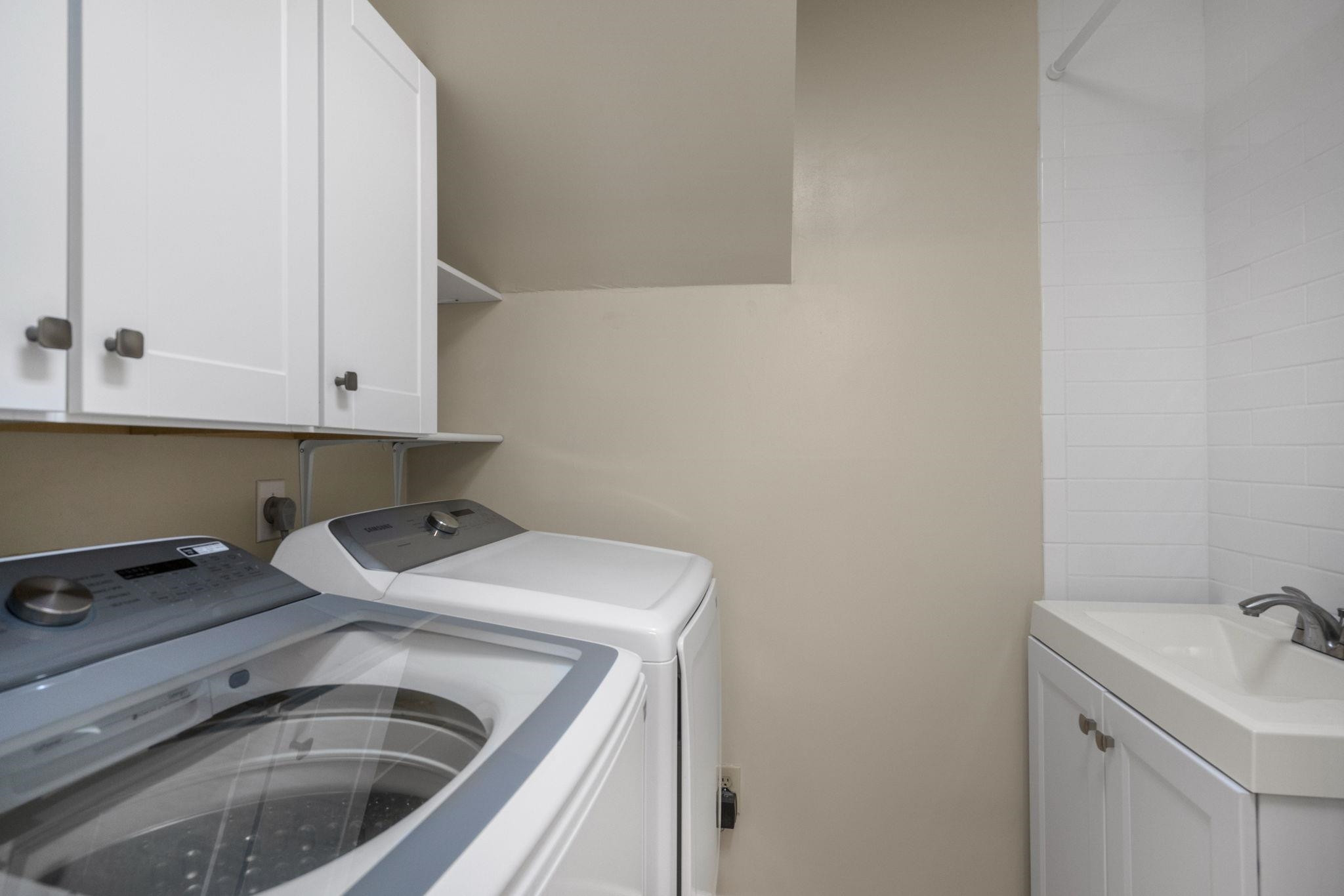 108 Rushingwater Drive Cary, NC 27513 - Photo 29 of 37 a utility room with dryer and washer