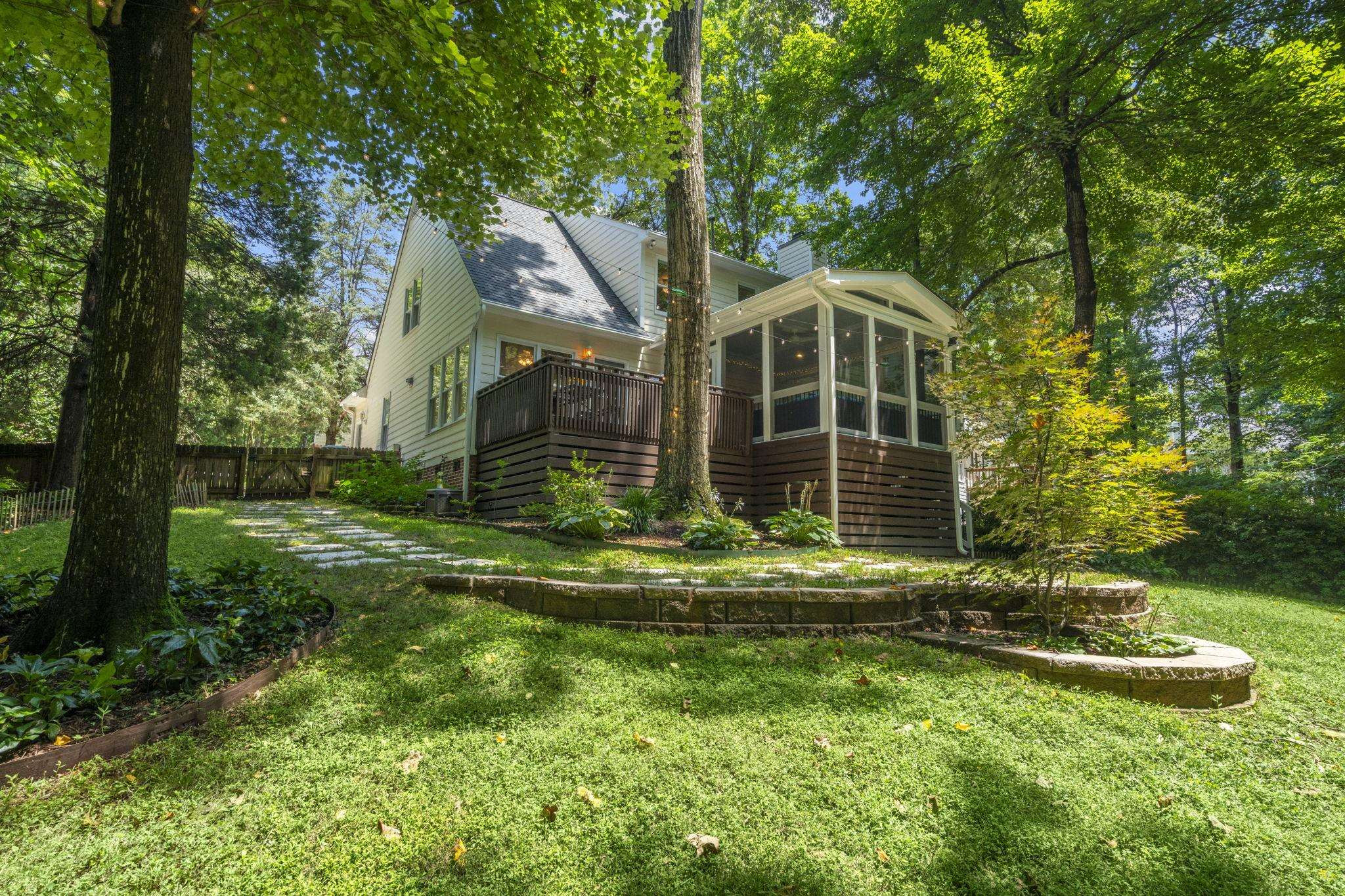 108 Rushingwater Drive Cary, NC 27513 - Photo 30 of 37 a front view of a house with a yard table and chairs