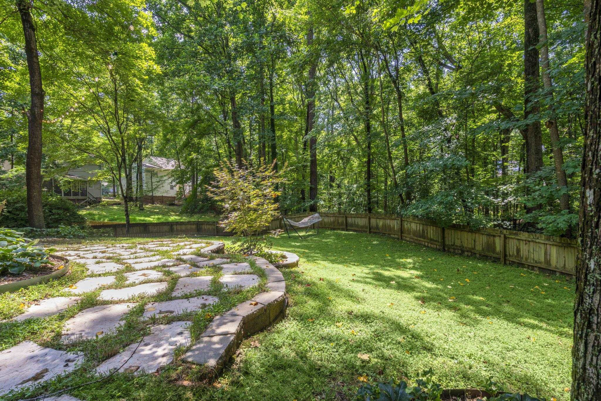 108 Rushingwater Drive Cary, NC 27513 - Photo 34 of 37 a backyard of a house with lots of green space
