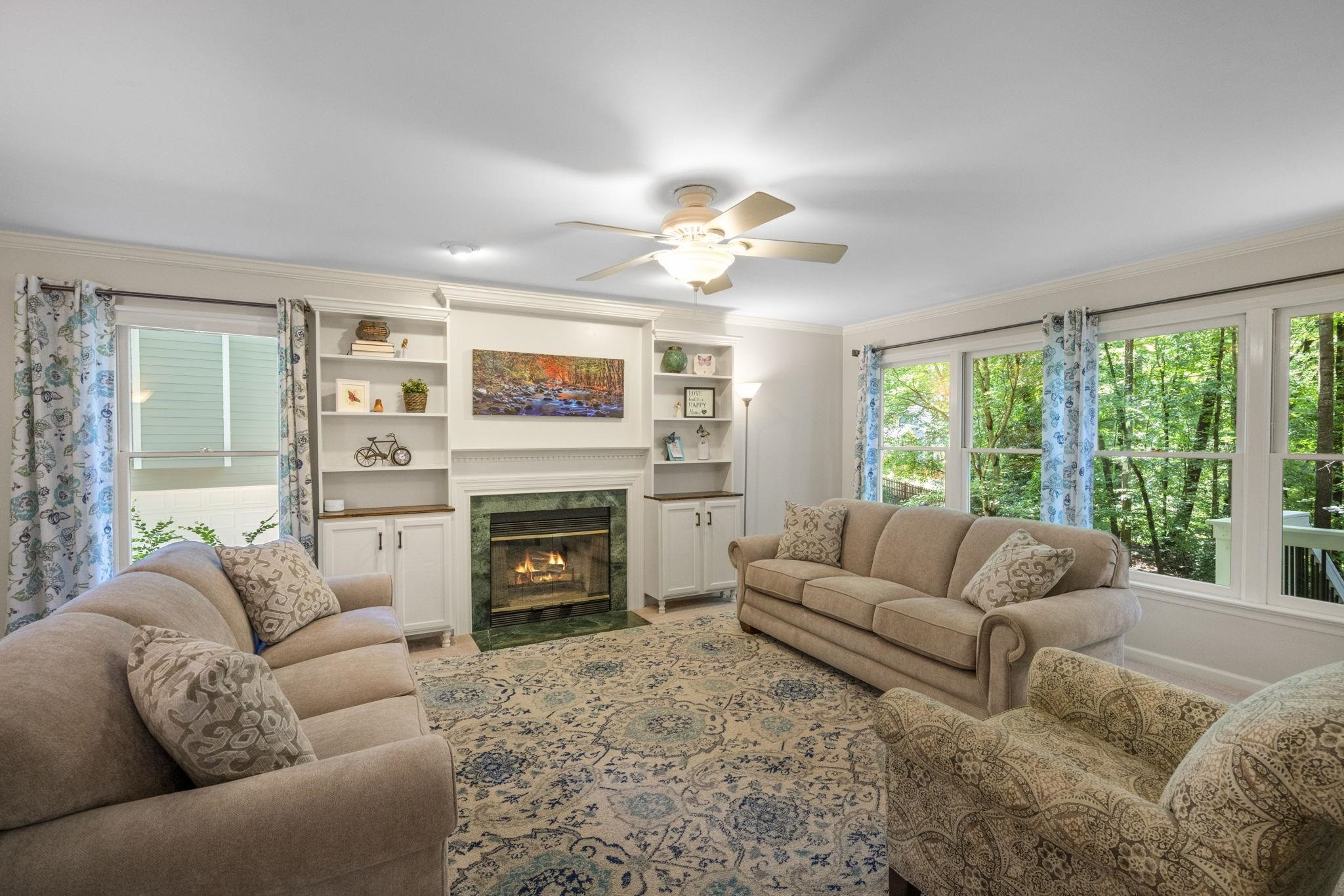 108 Rushingwater Drive Cary, NC 27513 - Photo 4 of 37 a living room with furniture fireplace and a large window