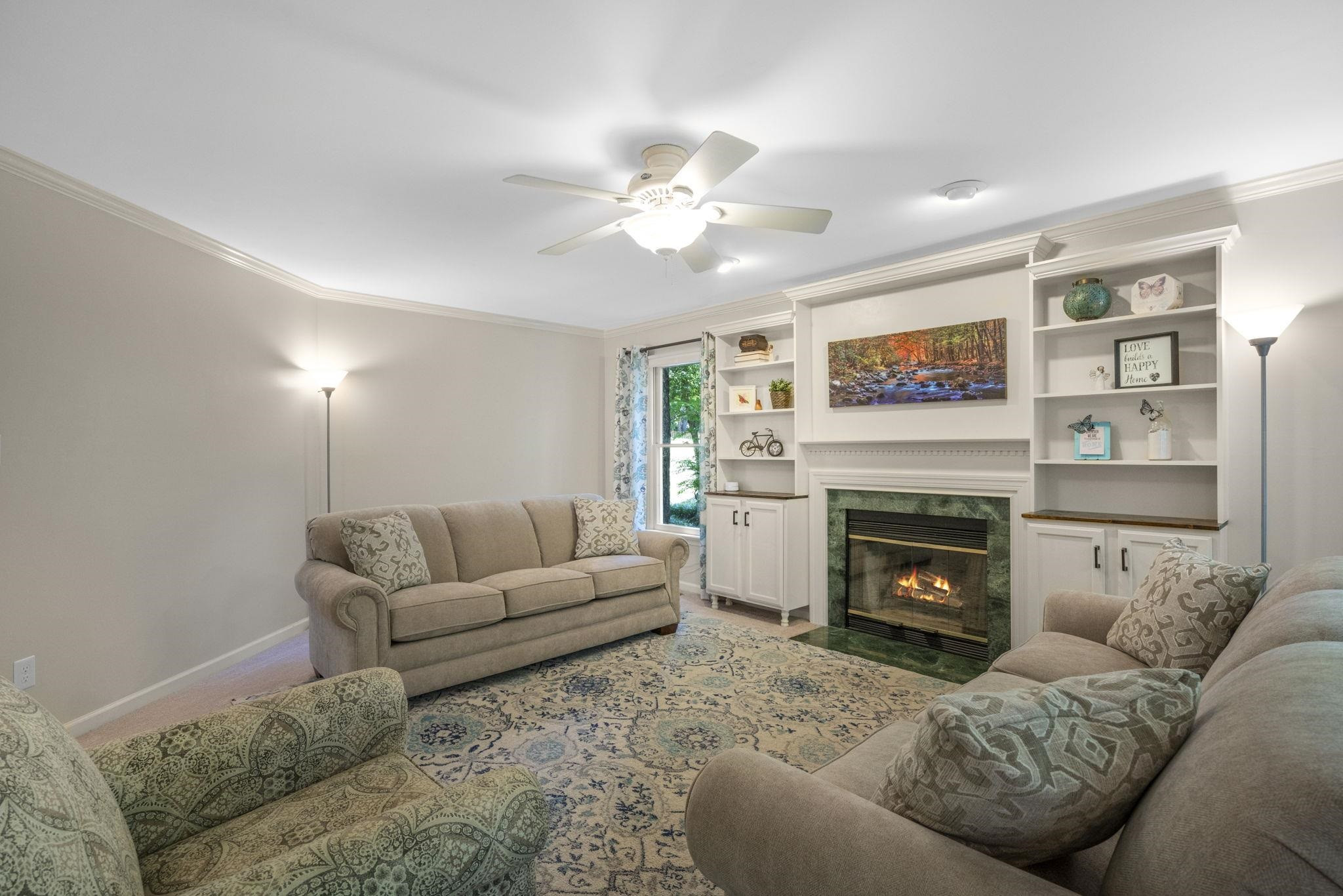 108 Rushingwater Drive Cary, NC 27513 - Photo 5 of 37 a living room with furniture and a fireplace