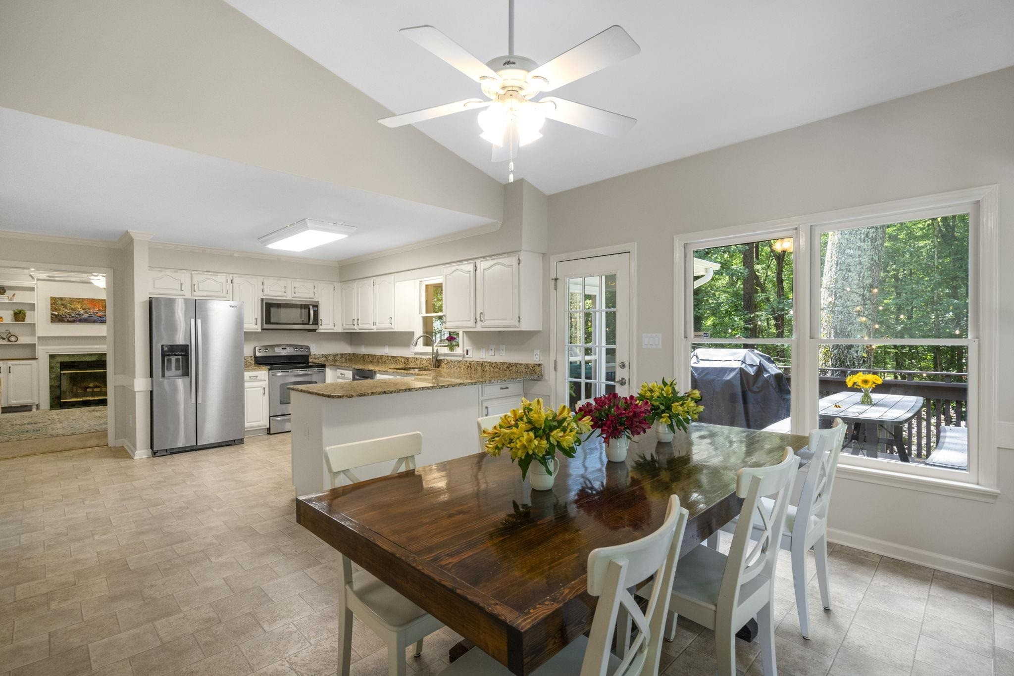 108 Rushingwater Drive Cary, NC 27513 - Photo 10 of 37 a kitchen with a dining table chairs and refrigerator