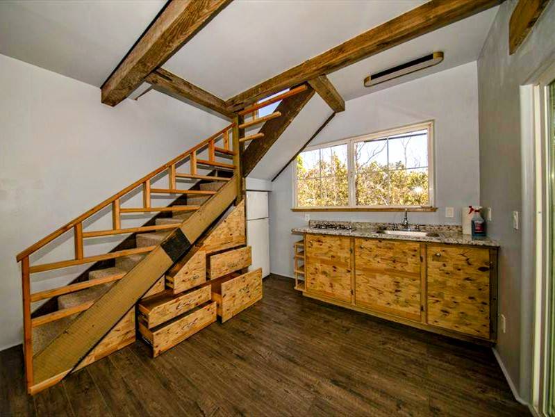 a view of an entryway with wooden floor and stairs