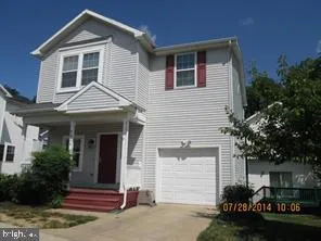 a front view of a house with garage