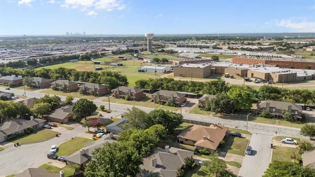an aerial view of residential houses with outdoor space