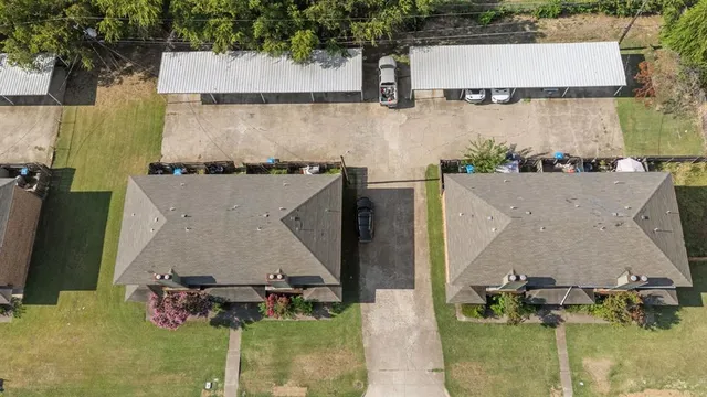 an aerial view of residential houses with outdoor space