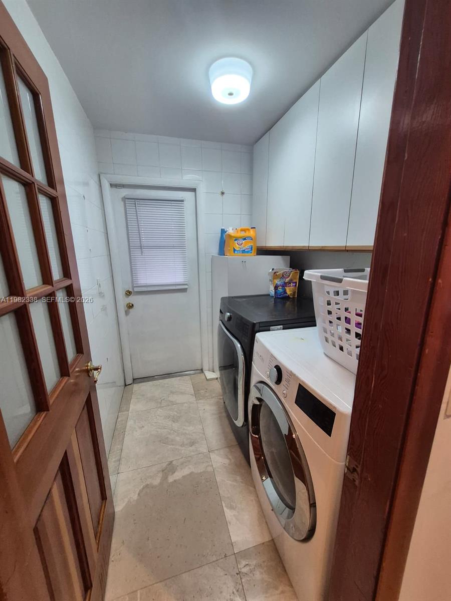14530 Southwest 110th Street Miami, FL 33186 - Photo 33 of 45 a utility room with dryer and washer