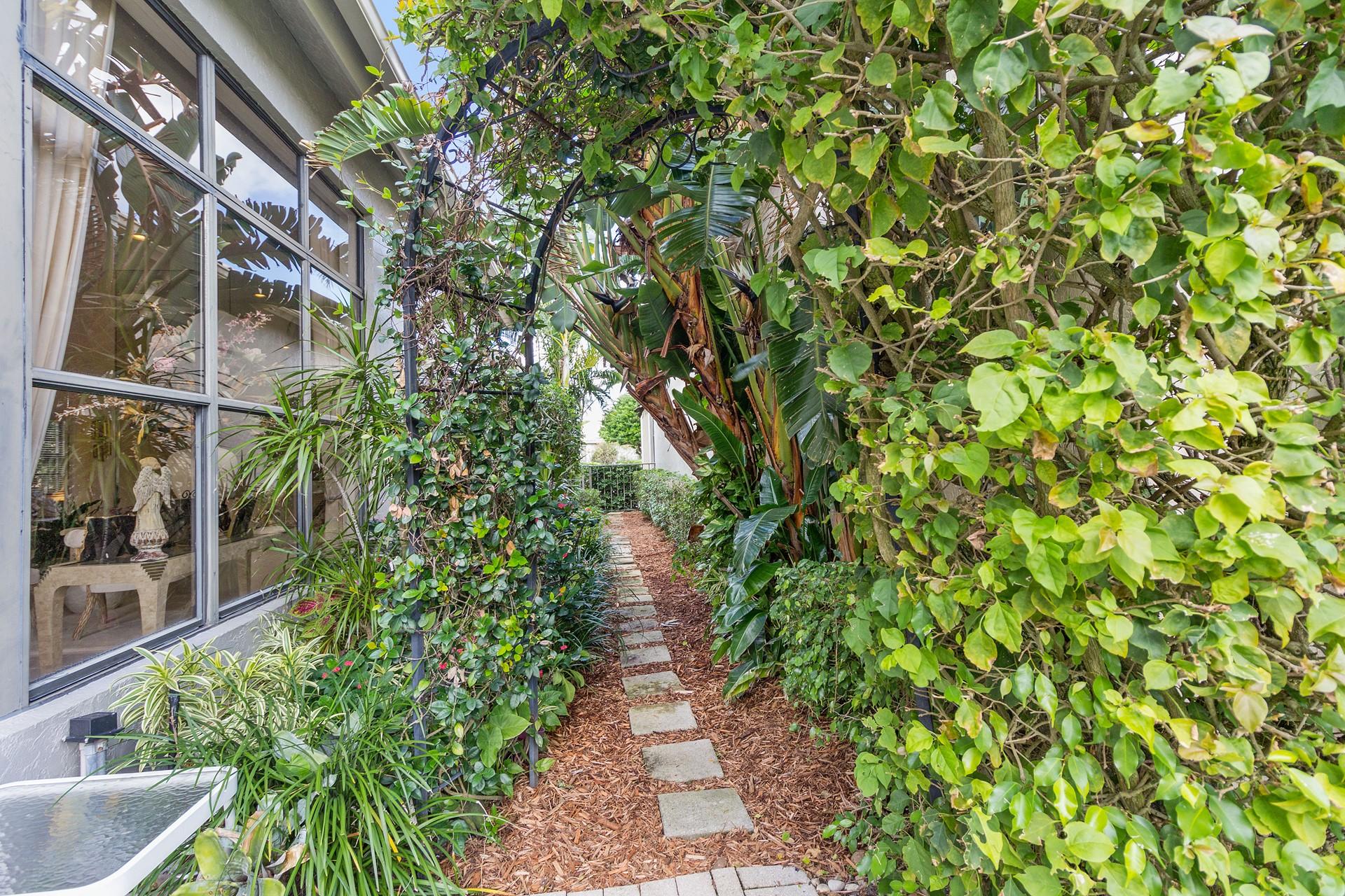 2486 Northwest 63rd Street Boca Raton, FL 33496 - Photo 23 of 26 side walkway