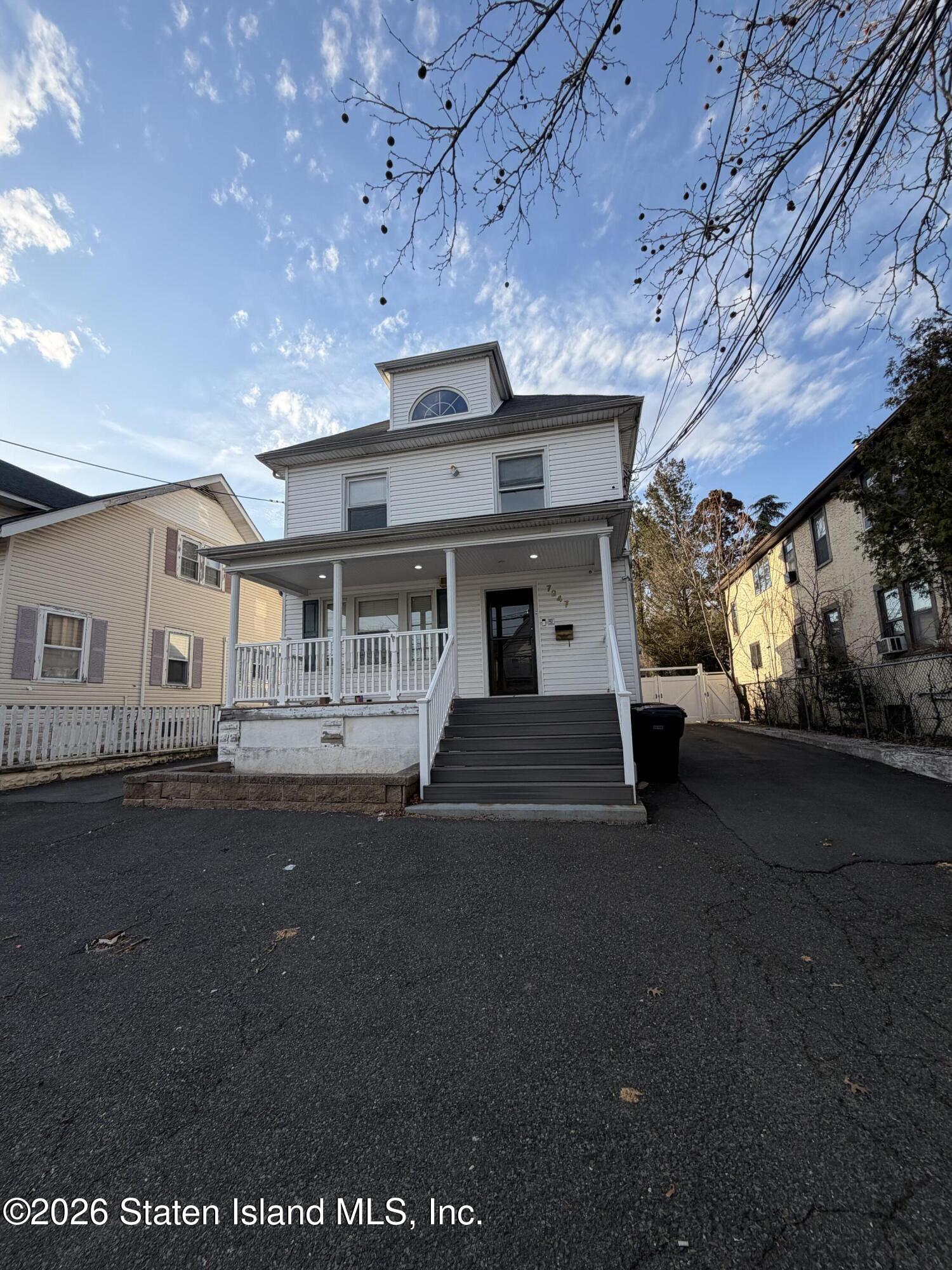 front view of a house with a street