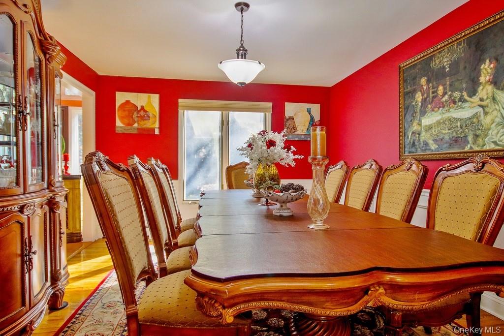 7 Park Place Chester, NY 10918 - Photo 13 of 48 a view of a dining room with furniture one side kitchen view and wooden floor