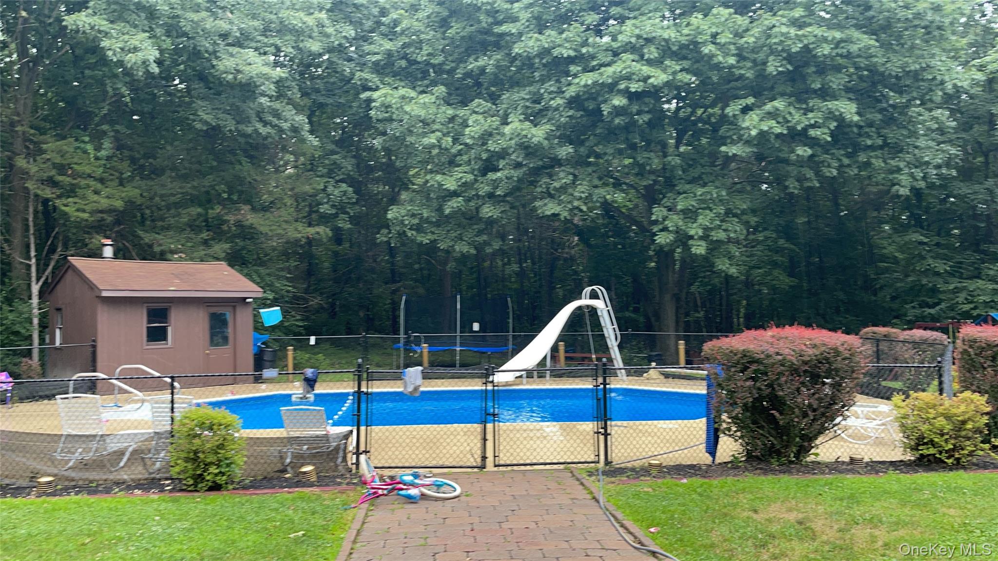 7 Park Place Chester, NY 10918 - Photo 3 of 48 a front view of a house with swimming pool and garden
