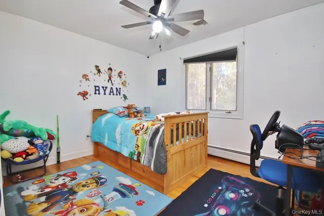 a bedroom with furniture and a window